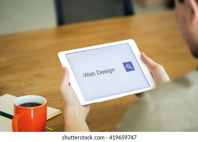 Man Searching WEB DESIGN With Tablet Pc