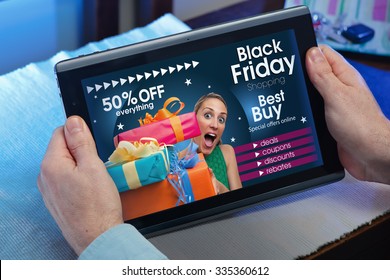 man searching website internet store to purchase gifts online in Black Friday with your tablet in you home / hands of a man at a website with an announcement concept for black friday deals - Powered by Shutterstock