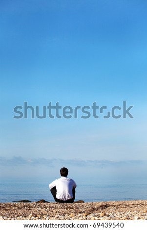 Similar – a woman looks at the sea. rear view, blurred