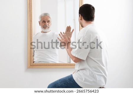 Man seeing himself as elder in mirror. Conceptual collage about past and future, flow of time, age