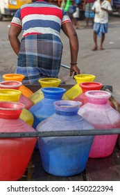 A Man Seen Transporting Water In Plastic Buckets After Paying Money In A Tricycle, Depicting Water Crisis During Summer In Chennai City Tamil Nadu India