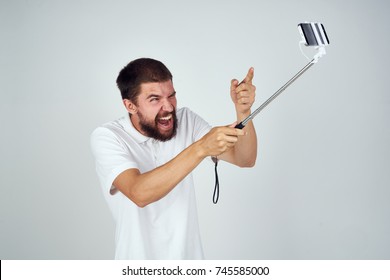 Man With Selfie Stick, Phone, Monopod                               