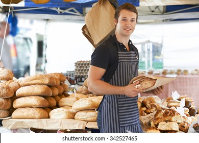 Man Selling Bread At Outdoor Market