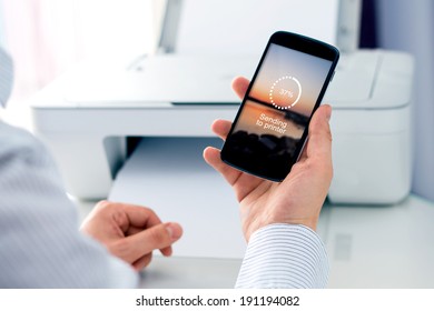 Man Sending A Photo To Wireless Printer. Cloud Print Concept