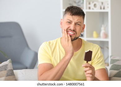 Man With Sensitive Teeth And Cold Ice-cream At Home