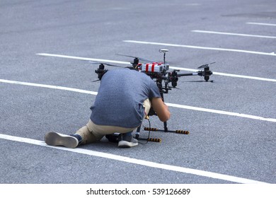 the man setting drone before flying for take picture