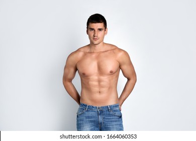 Man With Sexy Body On Light Background