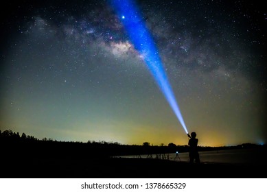 The Man Shining The Torch To Milky Way / Milky Way With Lighting