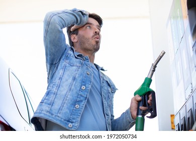 man in shock with gas price