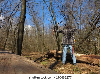 Man Shoot With A Recurve Bow In The Forest