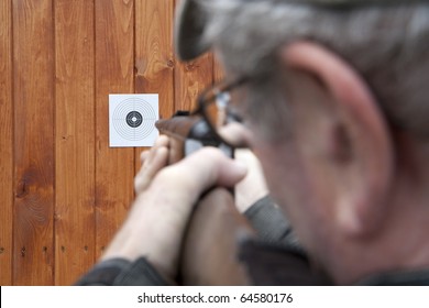 Man Shooting With Air Gun