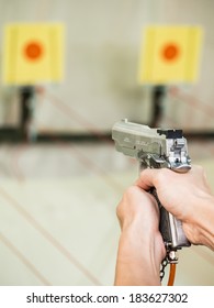 Man Shooting With Air Gun On Target