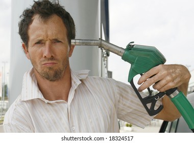 man shooting himself over crazy petrol prices - Shutterstock ID 18324517
