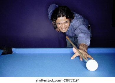 Man Shooting Pool