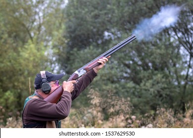 Man Shooting Shotgun With Smoke
