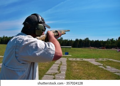 man shooting skeet with shotgun