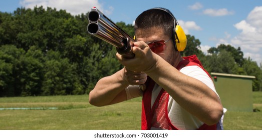 Man Shooting Skeet With A Shotgun