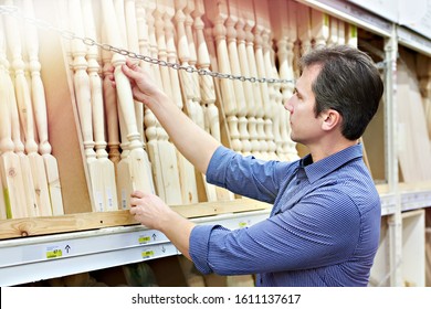 Man Shopping For Baluster Timber In DIY Shop