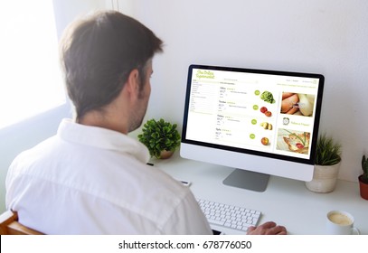 Man Shopping Groceries Online On Computer