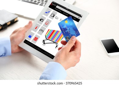 Man shopping online with digital tablet - Shutterstock ID 370965425