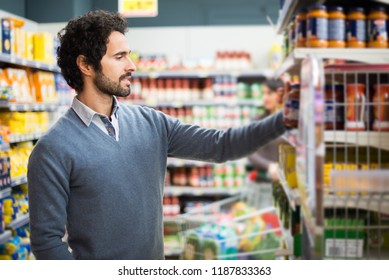 317 Man pick a basket in supermarket Stock Photos, Images & Photography ...