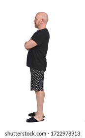 Man In Short Pant Pajamas On White Background, Arms Crossed, Profile