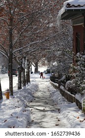 Man Shoveling In Capitol Hill Neighborhood, Salt Lake City, Utah After Snowfall