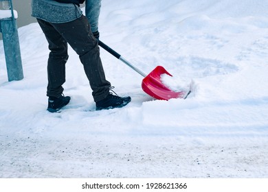 Man Shoveling Snow With A Snow Shovel