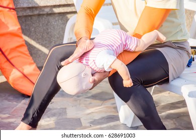 Man Show Technique Choking Infant Dummy Near The Pool