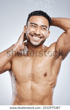 Man in shower with smile, cleaning and studio background for hygiene with shampoo, healthy body. Water, skin and hair care, happy male model washing with happiness on backdrop with bathroom spa time.