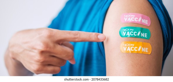 Man Showing Bandage After Receiving Covid 19 Vaccine. Vaccination, Herd Immunity, Side Effect, Booster Dose, Vaccine Passport And Coronavirus Pandemic