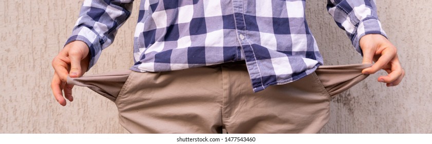 man showing the empty pockets, poor jobless homeless and moneyless concept