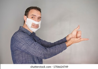 man showing the gesture of help along with a deaf-mute mask