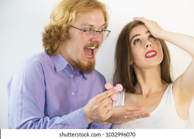 Man Showing Her Girlfriend Fidget Spinner. Woman Is Not Interested In This Trend