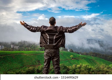 Man Showing His Beautiful Expression Above Tea Garden Image Is Taken At Munnar Kerala India From Low Angle Showing The Completion Of Journey Of Bike Trip And The Beautiful Nature.