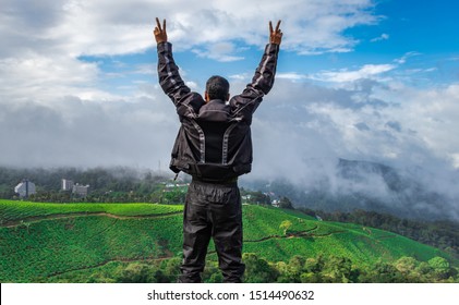 Man Showing His Beautiful Expression Above Tea Garden Image Is Taken At Munnar Kerala India From Low Angle Showing The Completion Of Journey Of Bike Trip And The Beautiful Nature.