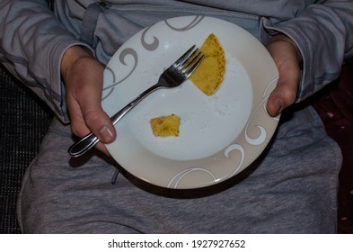 A Man Showing His Half Empty Plate