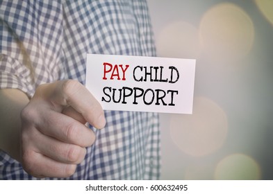 Man Showing Pay Child Support Card. Family And Care Concept.