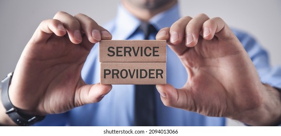 Man Showing Service Provider Text In Wooden Blocks.