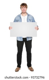 Man Showing Sign Standing In Full Body. Casual Young Guy Holding Blank Empty Banner Sign Isolated On White Background. Caucasian Male Model In His Twenties.