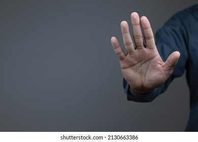 man showing stop gesture reject on black background with empty space for text, copy space, close up of the hand, anti concept, rejection
 - Shutterstock ID 2130663386