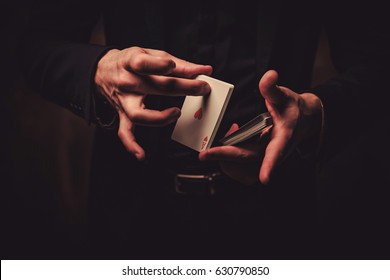 Man showing tricks with cards - Shutterstock ID 630790850