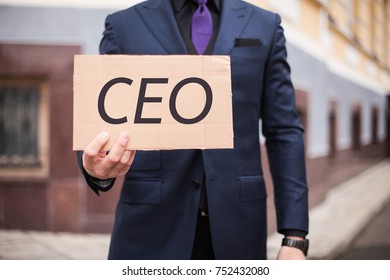 A man shows a cardboard tablet with the word "CEO" - Shutterstock ID 752432080