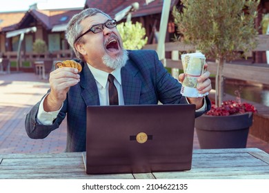 Man Shows Coins Bitcoins And Money Paper Cash, Next To A Laptop For Working On The Exchange. He Enjoys Winning Big Money And A Good Deal.