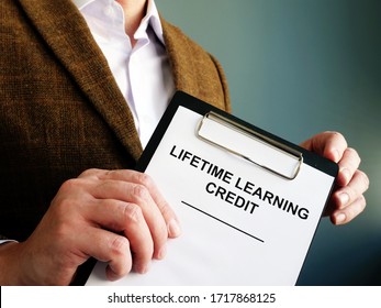 Man Shows Papers About Lifetime Learning Credit.