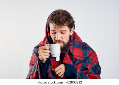 Man Sick With Flu Drinking Tea