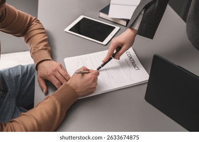 Man signing documents close-up of hand. Deal, agreement, contract signing. Legal advice, lawyer advocate