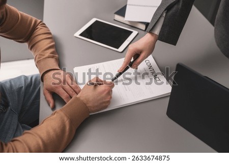 Man signing documents close-up of hand. Deal, agreement, contract signing. Legal advice, lawyer advocate