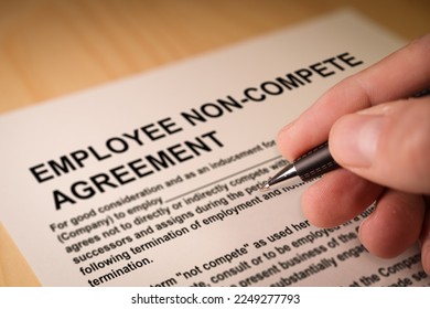 Man signing an employee Non-compete agreement - Shutterstock ID 2249277793
