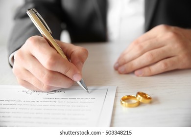 Man Signing Marriage Contract, Closeup